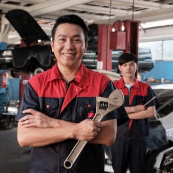 Tap to pay use case for repair services, man technician with wrench smiling